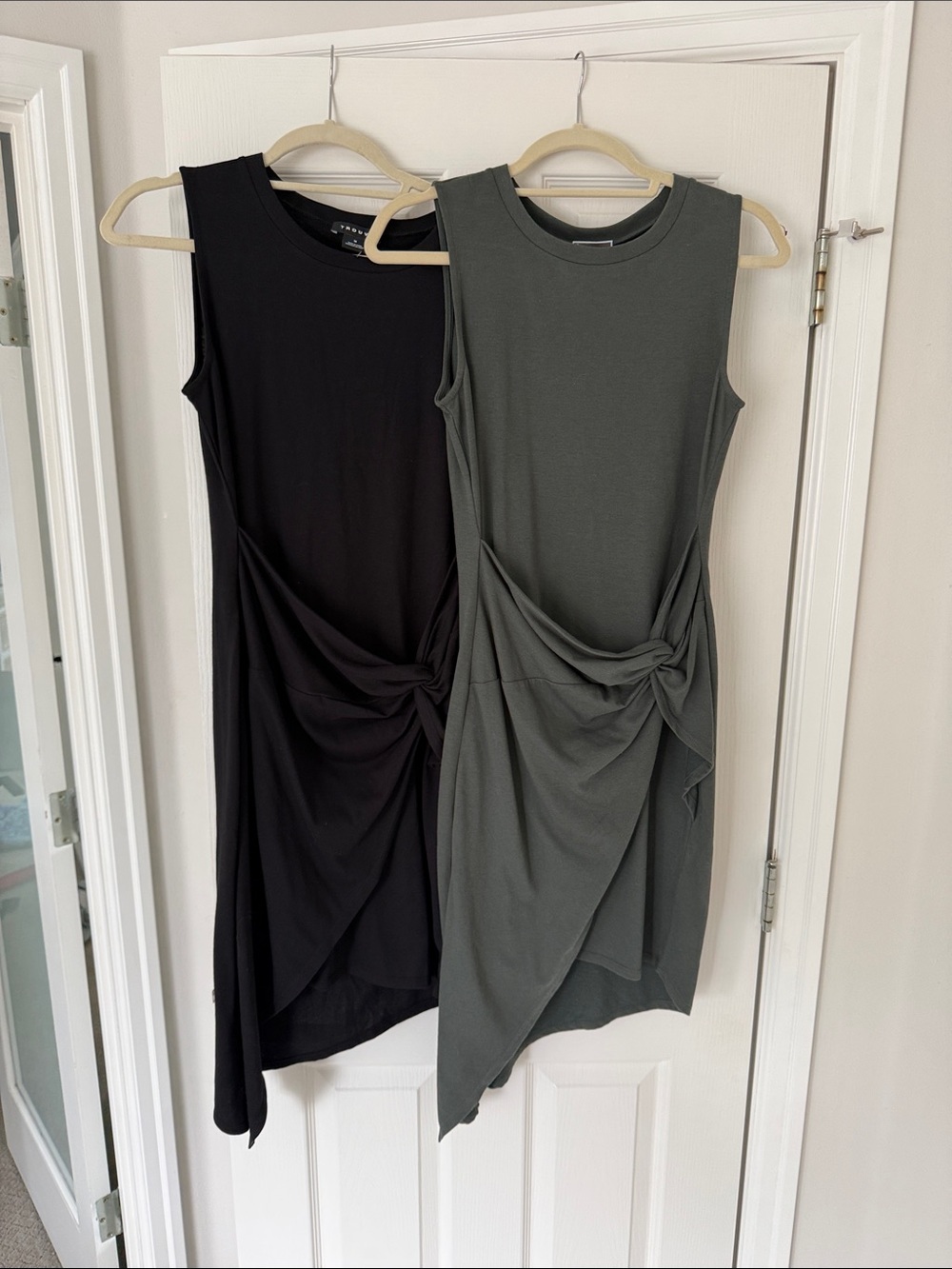 Two Trouvé Sleeveless Asymmetrical Twist-Knot Dresses in Black and Olive